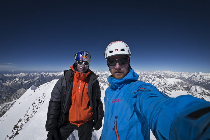 David and Peter on the ridge that connects the two peaks of roof shaped Chogolisa. ©Peter Ortner
